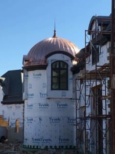 Curved roof tower coved in copper. Roofing construction by Alte Exteriors LLC.