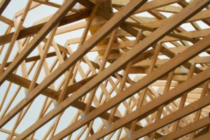 Wood rafters give a home's roof its structure and shape and help support the roof sheathing.
