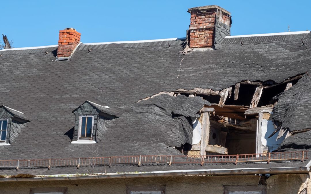 Image of the roof of a house with damage following a storm.