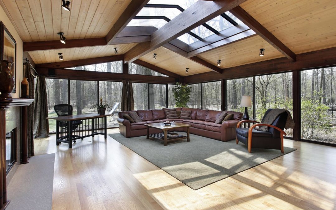 Light-filled living room with skylights in center of room.