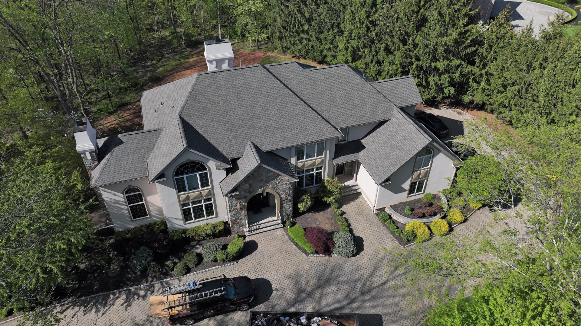 Arial image of large single family home with new roof installed by Alte Exteriors LLC
